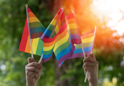 Raised rainbow flags, representing Pride Month 2023 | RSC Fertility New Jersey